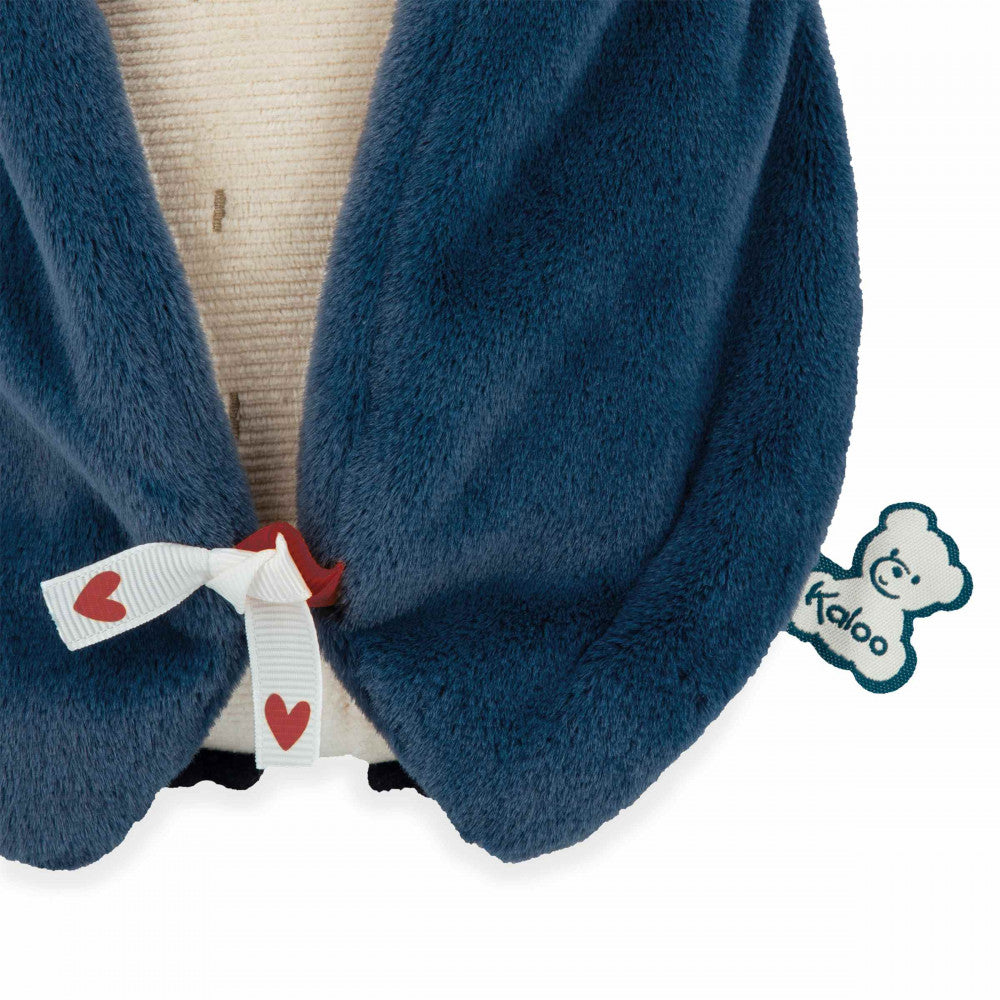 Peluche à bruits blanc manchot bleu