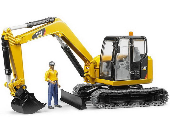 Excavatrice CAT avec ouvrier